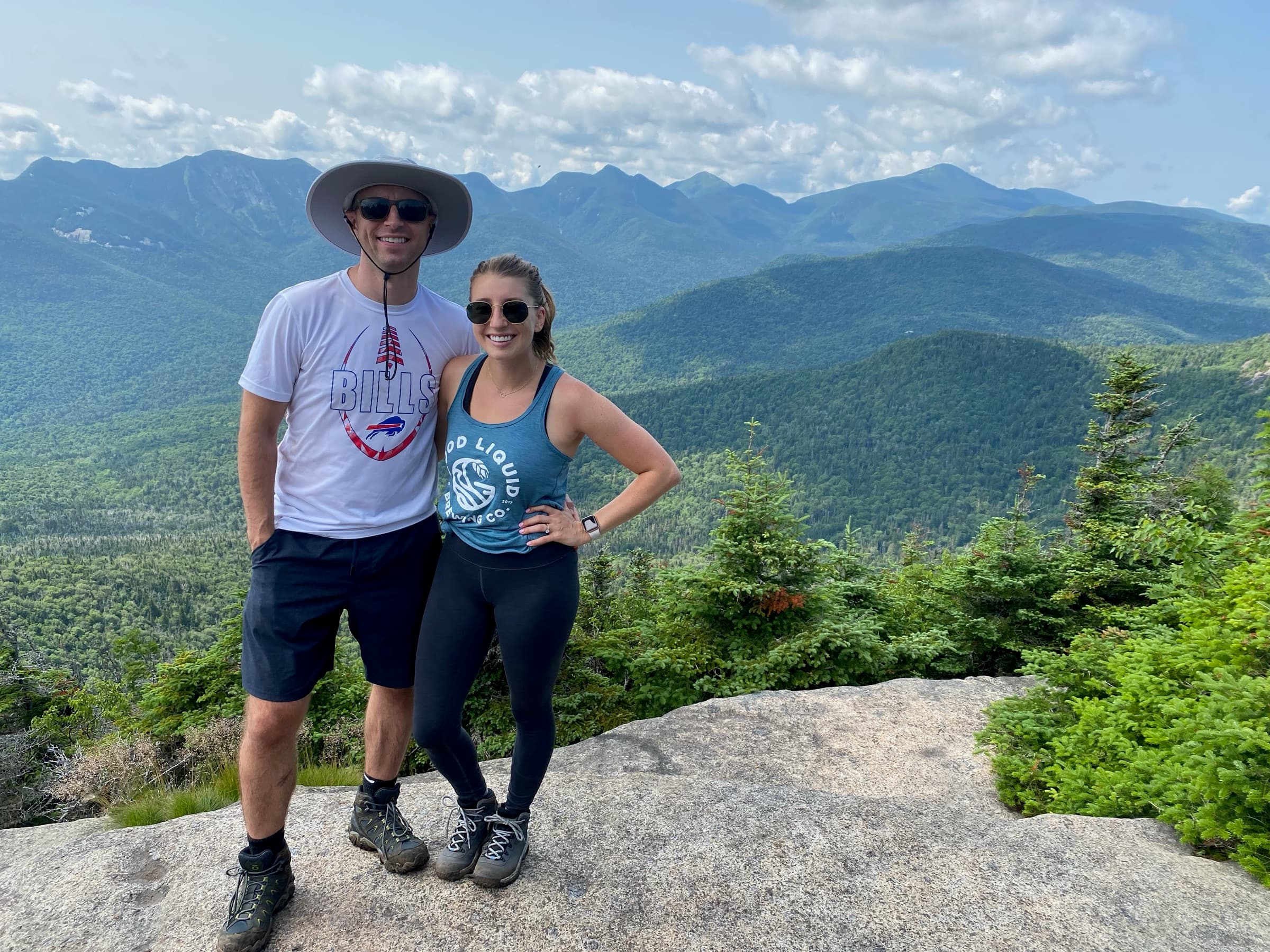 Brett and Erin on an Adirondack summit with the High Peaks behind them